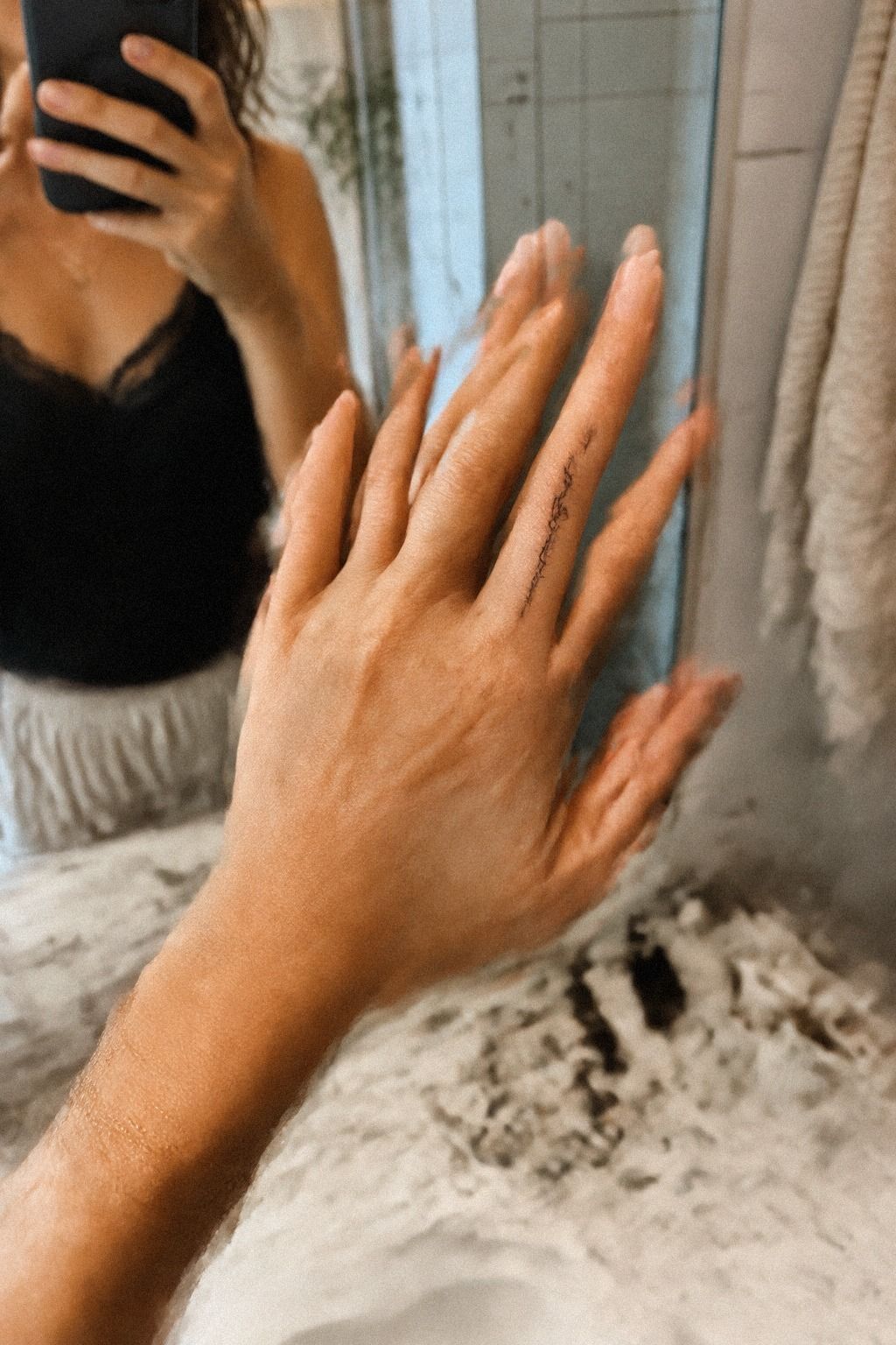 Delicate Script Along the Finger Edge